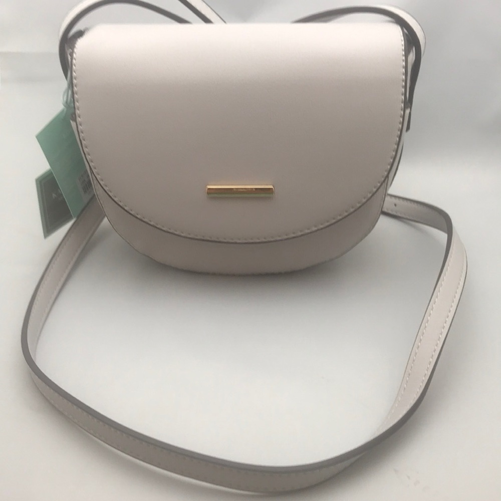 Saddle style crossbody